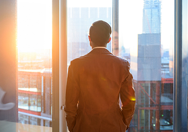 Advisor looking out window
